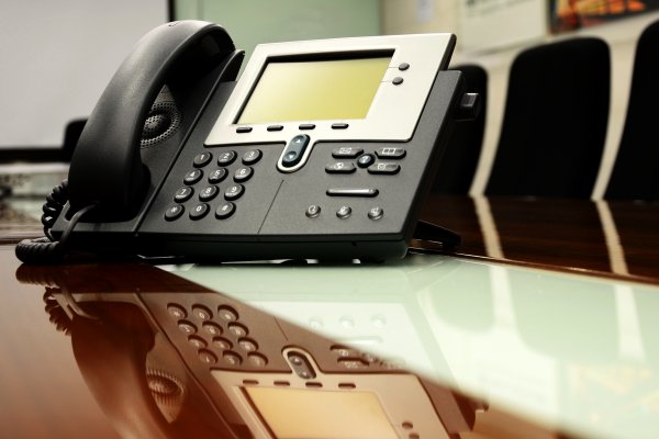 axvoice voip service black voip phone on desk office chairs